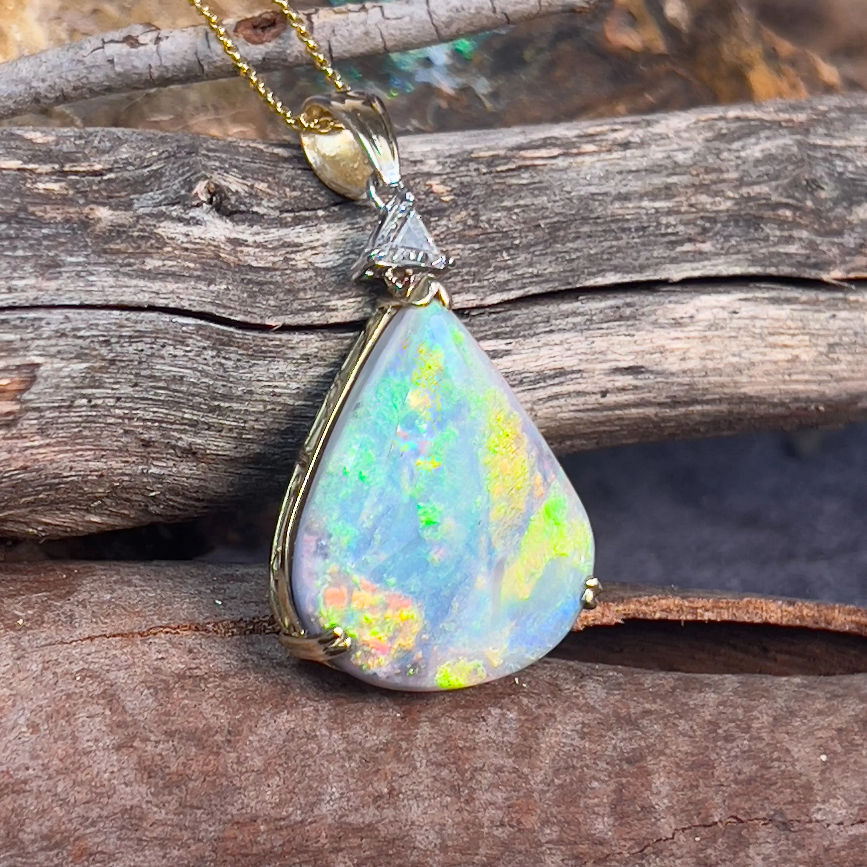 18kt Yellow Gold Pear shape Black Opal 20.05ct and Trillion cut diamond pendant