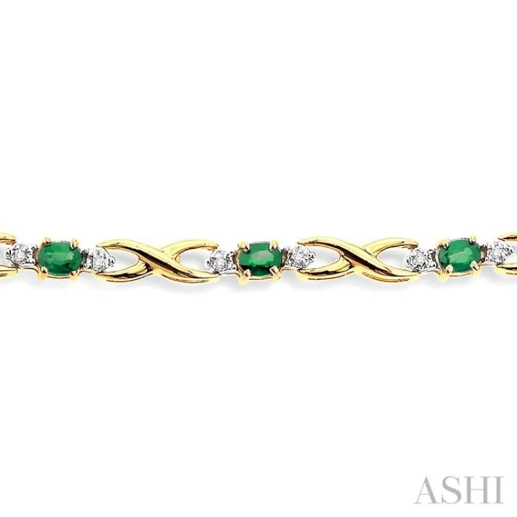 4x3mm Oval Cut Emerald and 1/10 Ctw Single Cut Diamond Bracelet in 10K Yellow Gold