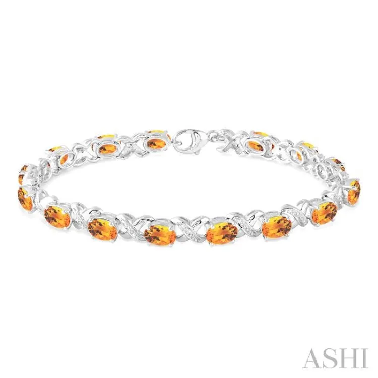 7x5  MM Oval Cut Citrine and 1/20 Ctw Round Cut Diamond Fashion Bracelet in Sterling Silver