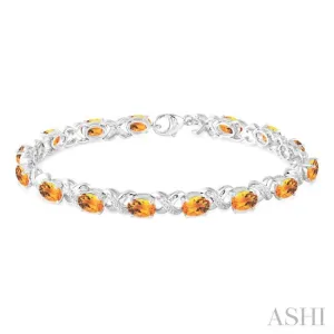 7x5  MM Oval Cut Citrine and 1/20 Ctw Round Cut Diamond Fashion Bracelet in Sterling Silver