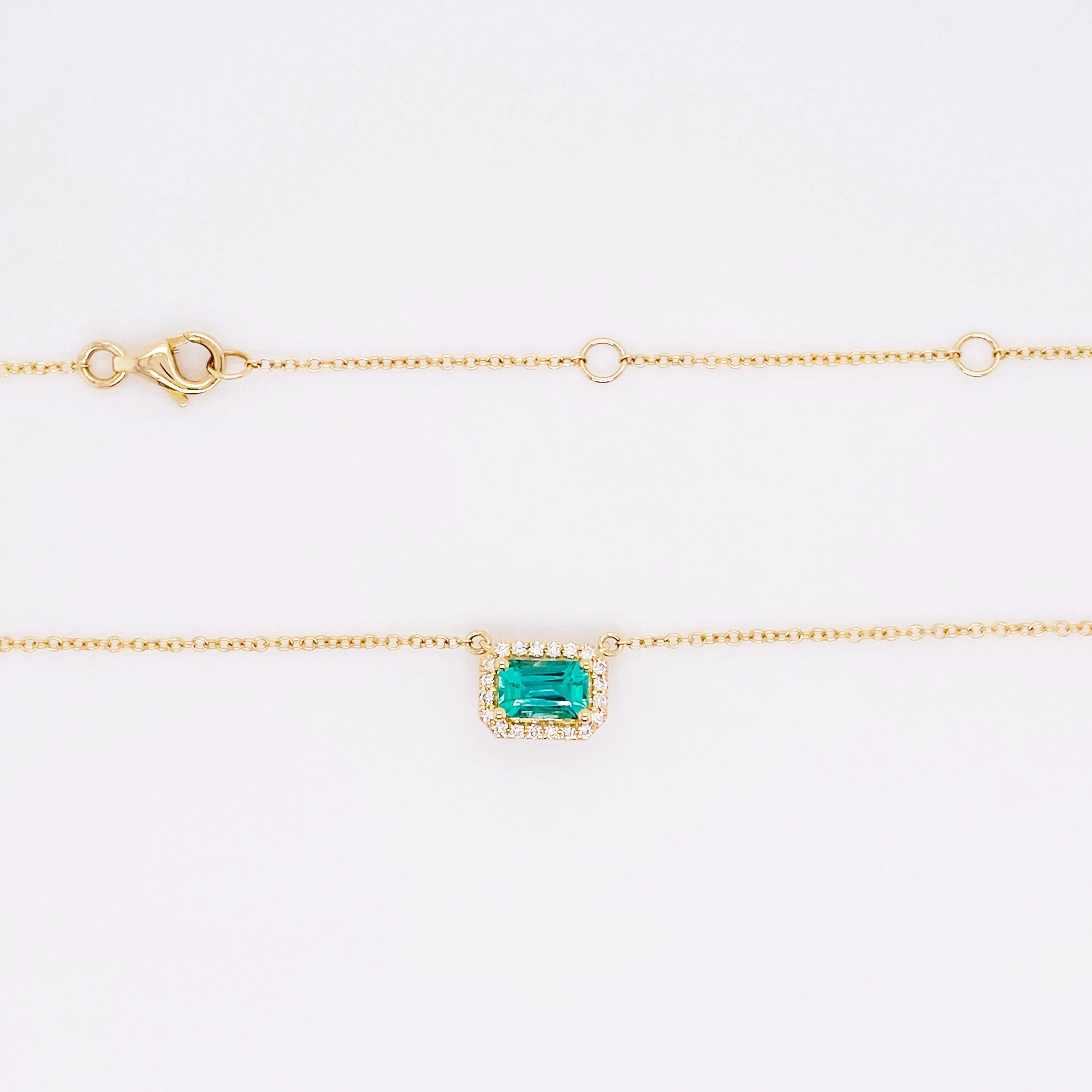 Horizontal Emerald and Diamond Halo Pendant