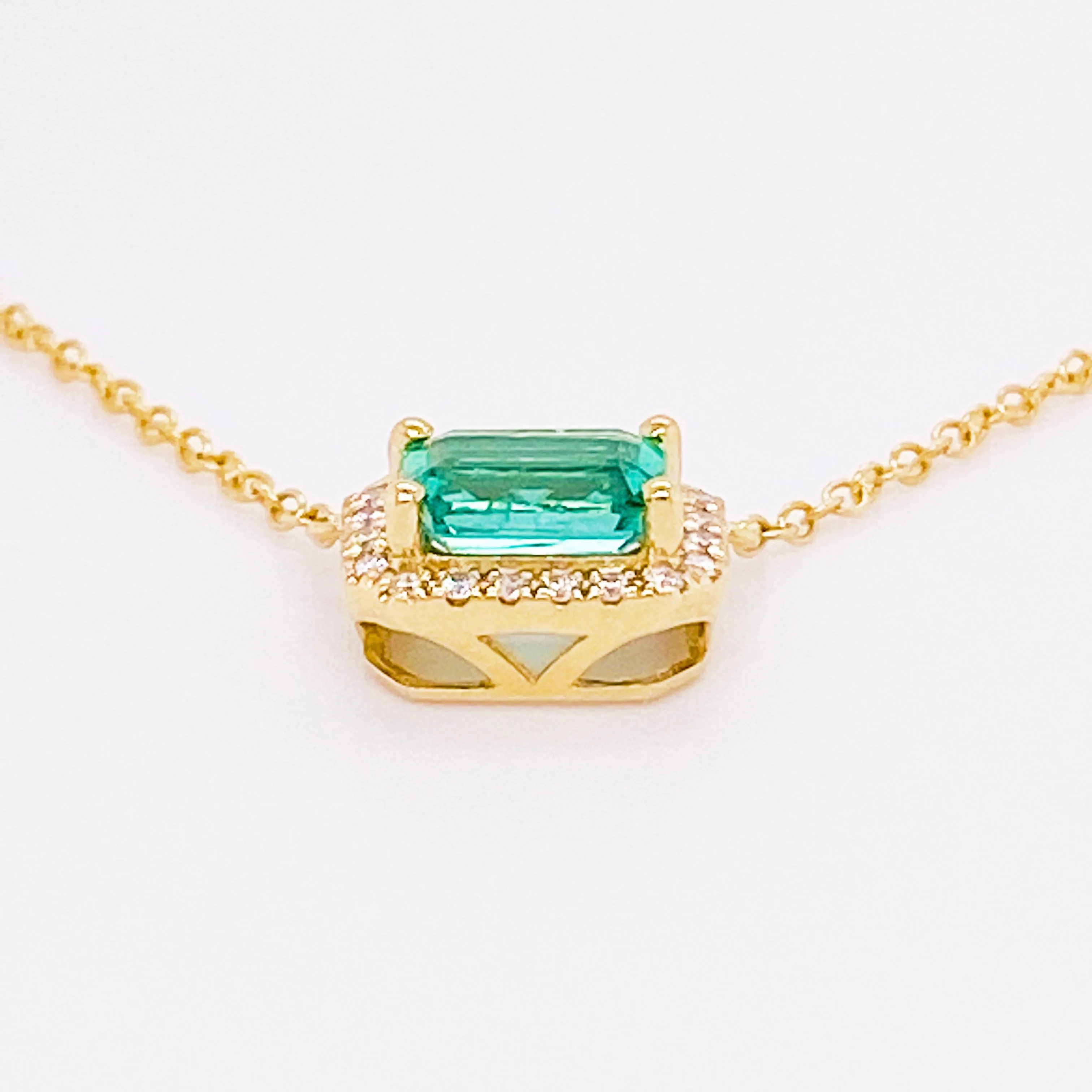 Horizontal Emerald and Diamond Halo Pendant