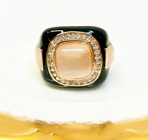 Large cocktail ring white black enamel accents set in a rose gold style metal.