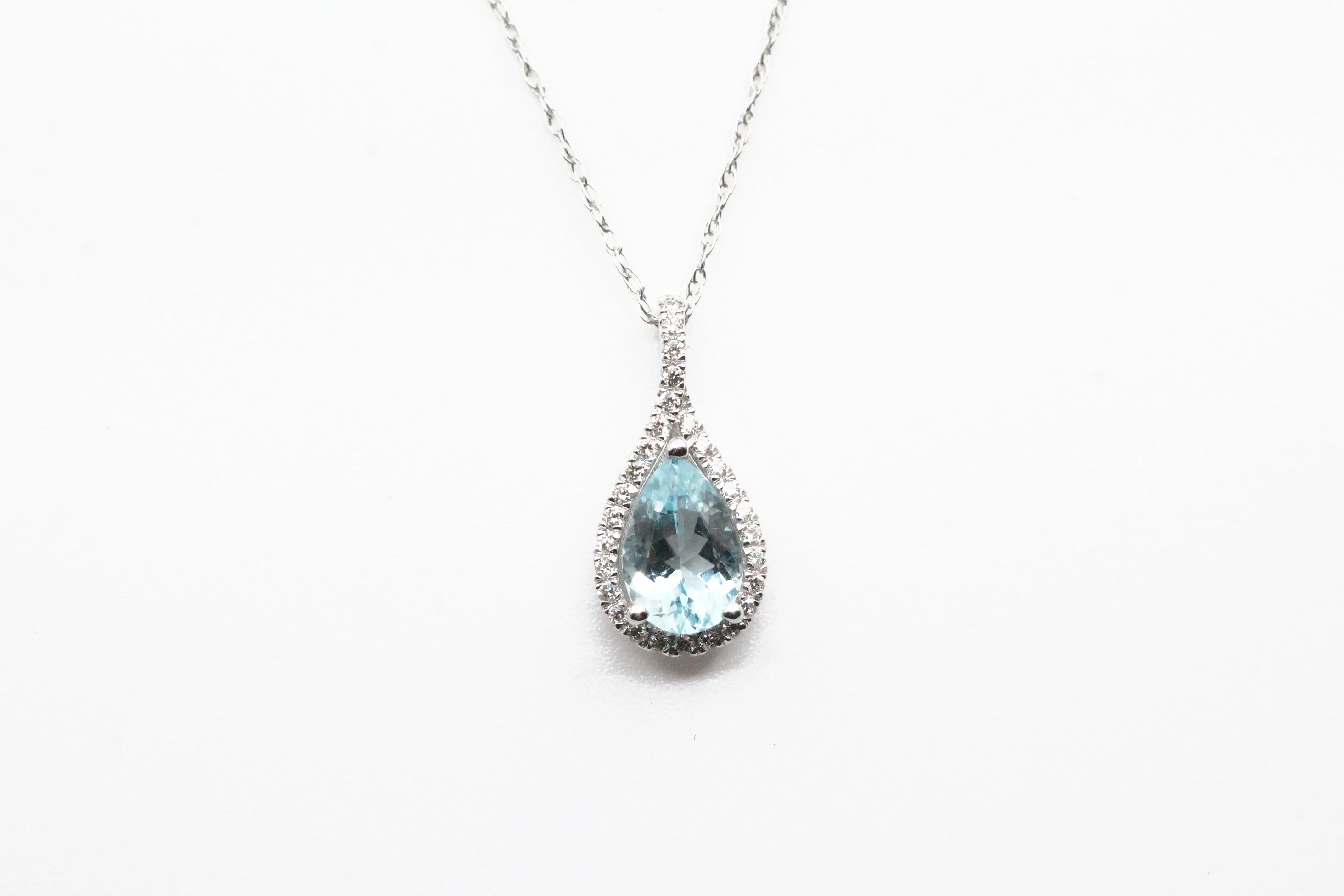 White Gold Pear Shaped Aquamarine Pendant with Diamond Halo